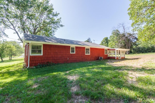 1318 S Farm Rd Unit 205, Springfield, MO 65809 - view of home's exterior with a lawn and central air condition unit