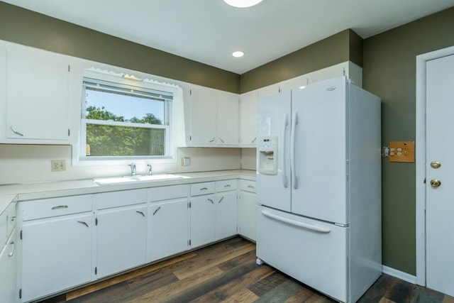1318 S Farm Rd Unit 205, Springfield, MO 65809 - kitchen featuring white fridge with ice dispenser, a sink, light countertops, dark wood-type flooring, and white cabinetry