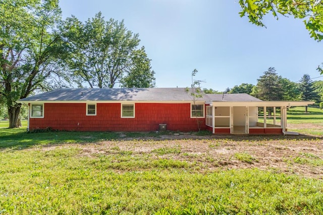 1318 S Farm Rd Unit 205, Springfield, MO 65809 - rear view of house with a sunroom and a lawn