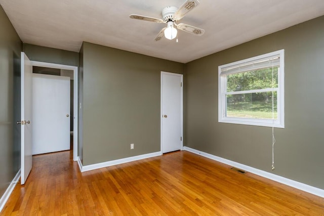 1318 S Farm Rd Unit 205, Springfield, MO 65809 - unfurnished bedroom with light wood finished floors, baseboards, and a ceiling fan