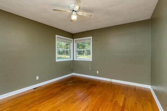 1318 S Farm Rd Unit 205, Springfield, MO 65809 - empty room with baseboards, wood finished floors, and ceiling fan