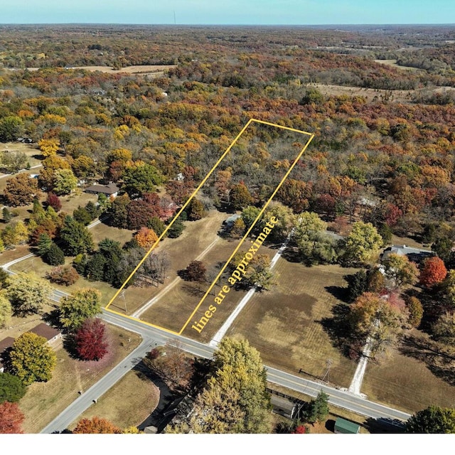 1318 S Farm Rd Unit 205, Springfield, MO 65809 - aerial view of property and surrounding area with property boundaries highlighted and a forest