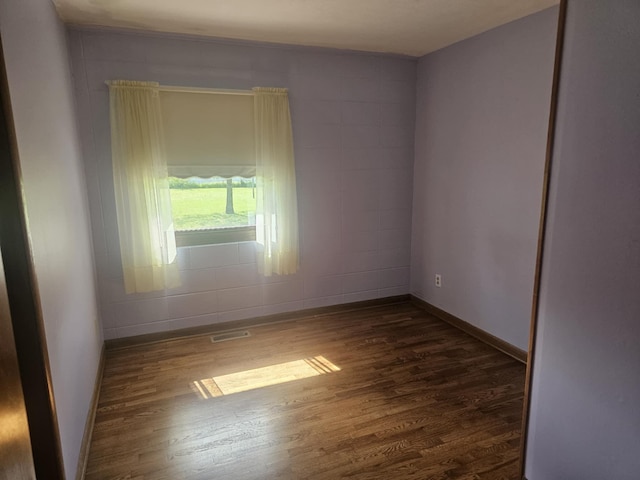 407 N Crestview Ave, Ash Grove, MO 65604 - spare room featuring dark wood-style floors and baseboards