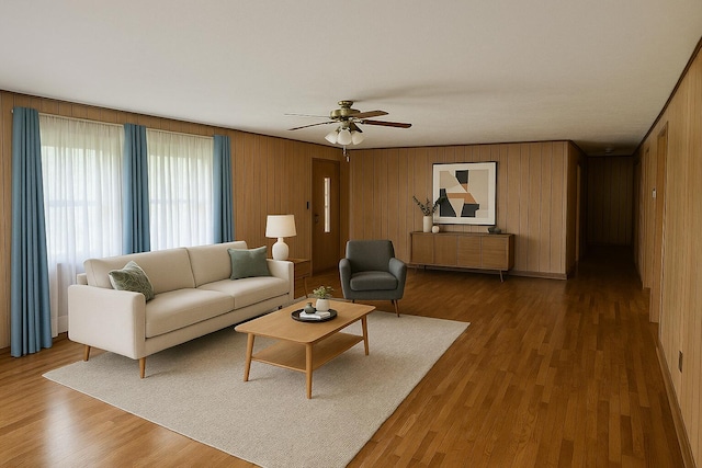 407 N Crestview Ave, Ash Grove, MO 65604 - living area featuring a ceiling fan, wood finished floors, and wooden walls