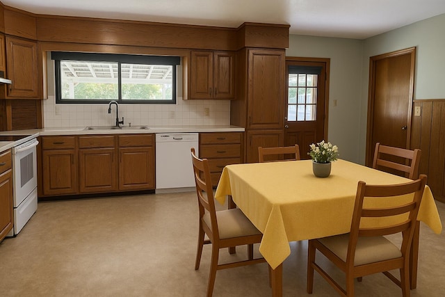 407 N Crestview Ave, Ash Grove, MO 65604 - kitchen with white appliances, brown cabinetry, backsplash, and light countertops
