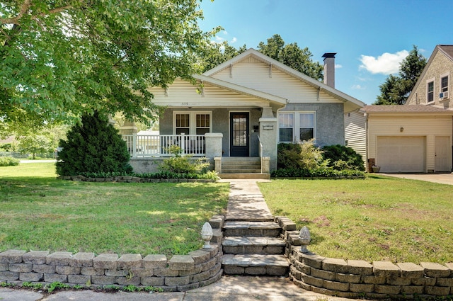 559 E Pleasant St, Mount Vernon, MO 65712 - view of front of home with a porch, a front yard, a chimney, and a garage