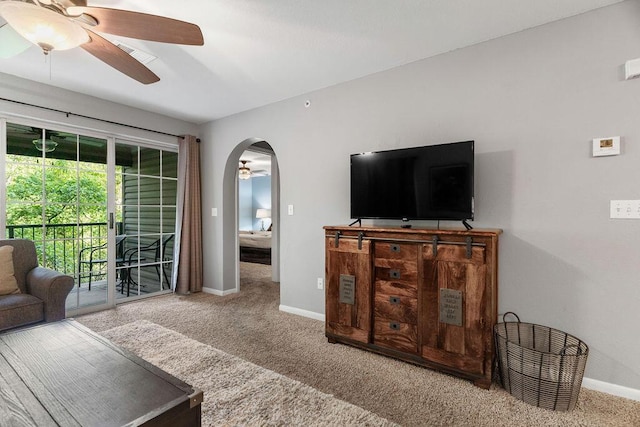 175 W Rockford Dr Unit 6, Branson, MO 65616 - carpeted living area with a ceiling fan, baseboards, and arched walkways