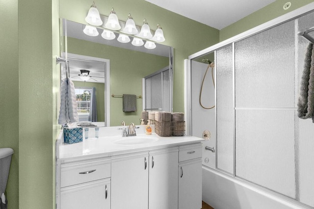 175 W Rockford Dr Unit 6, Branson, MO 65616 - bathroom featuring vanity, bath / shower combo with glass door, a ceiling fan, and toilet
