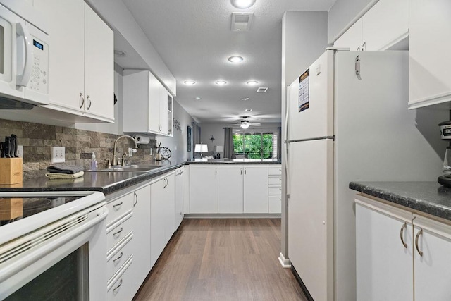 175 W Rockford Dr Unit 6, Branson, MO 65616 - kitchen featuring white appliances, a sink, dark wood finished floors, white cabinets, and recessed lighting