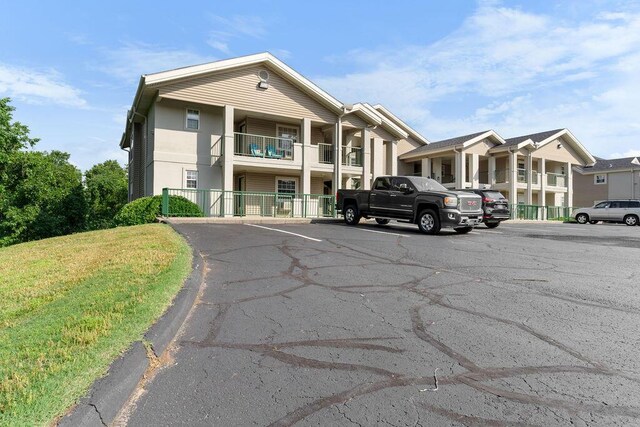 175 W Rockford Dr Unit 6, Branson, MO 65616 - view of building exterior with uncovered parking