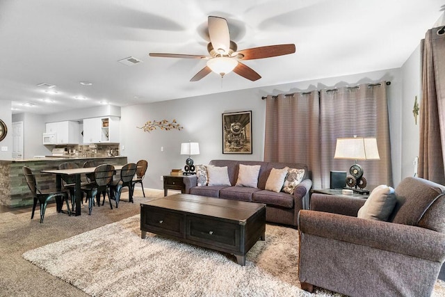 175 W Rockford Dr Unit 6, Branson, MO 65616 - living area with ceiling fan and light colored carpet