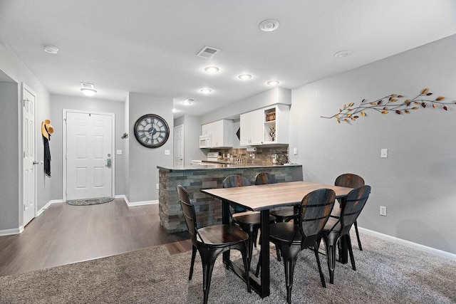 175 W Rockford Dr Unit 6, Branson, MO 65616 - dining area with baseboards and dark wood-type flooring