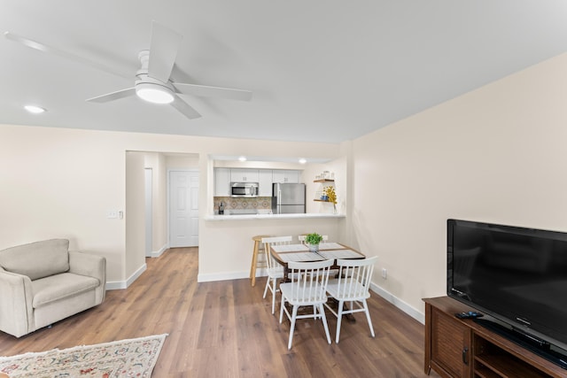 264 Turnberry Dr Unit 2, Branson, MO 65615 - dining room featuring wood finished floors, baseboards, a ceiling fan, and recessed lighting