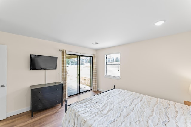 264 Turnberry Dr Unit 2, Branson, MO 65615 - bedroom with access to outside, light wood-type flooring, and baseboards