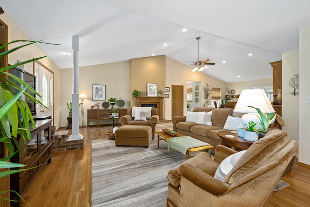1362 Meadowview Ln, Diamond, MO 64840 - living area featuring wood finished floors, vaulted ceiling, a ceiling fan, recessed lighting, and a fireplace
