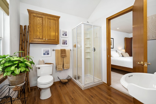 1362 Meadowview Ln, Diamond, MO 64840 - ensuite bathroom with wood finished floors, a shower stall, and toilet