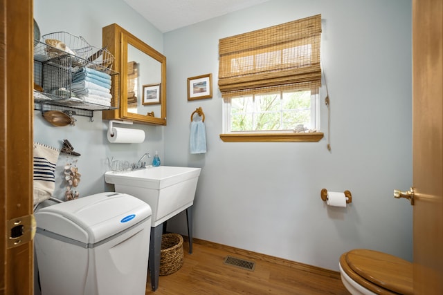 1362 Meadowview Ln, Diamond, MO 64840 - half bath featuring toilet, wood finished floors, and baseboards