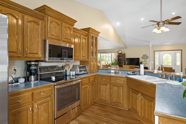 1362 Meadowview Ln, Diamond, MO 64840 - kitchen featuring stainless steel appliances, a sink, lofted ceiling, a ceiling fan, and light wood finished floors