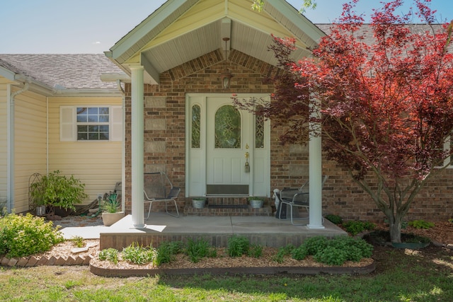 1362 Meadowview Ln, Diamond, MO 64840 - property entrance with a shingled roof and brick siding