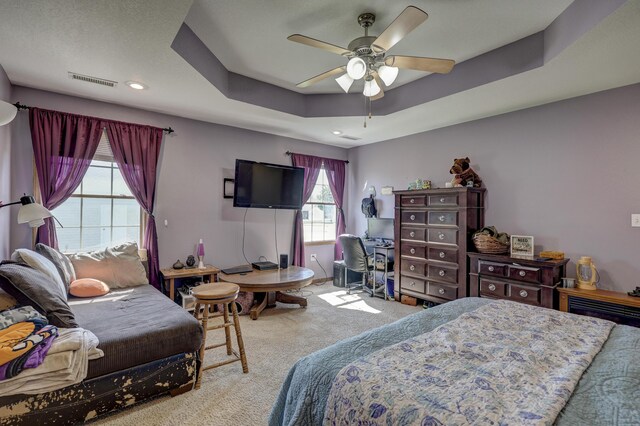 707 Lexie Ln, Carthage, MO 64836 - bedroom featuring carpet, a tray ceiling, a desk, ceiling fan, and recessed lighting