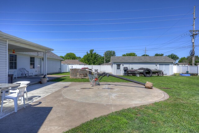 707 Lexie Ln, Carthage, MO 64836 - view of patio / terrace featuring an outbuilding