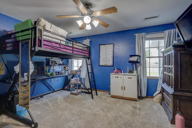 707 Lexie Ln, Carthage, MO 64836 - carpeted bedroom with multiple windows, a textured ceiling, baseboards, and a ceiling fan