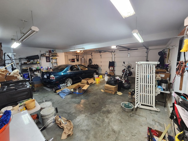 707 Lexie Ln, Carthage, MO 64836 - garage featuring a garage door opener