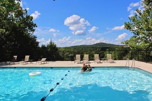 403 Lookout Flts, Branson, MO 65616 - community pool with a mountain view and a patio area