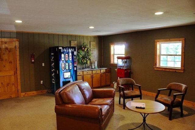 403 Lookout Flts, Branson, MO 65616 - living room with recessed lighting, light colored carpet, baseboards, and wooden walls