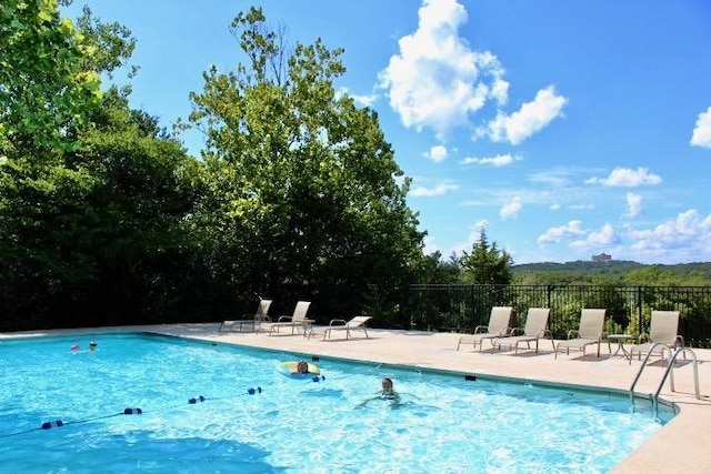 403 Lookout Flts, Branson, MO 65616 - community pool with a patio area