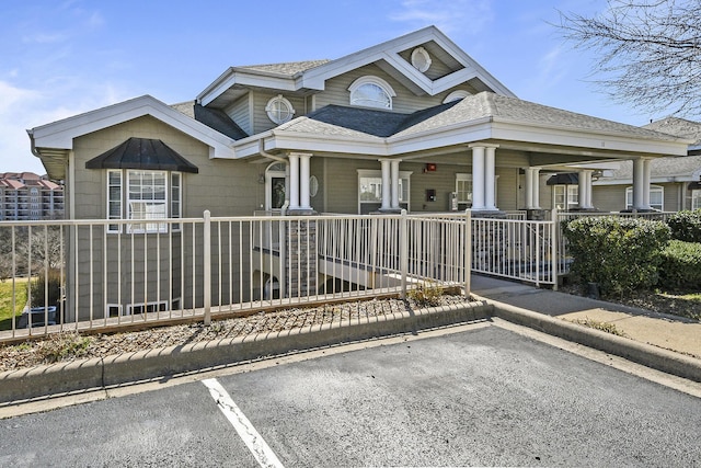300 Glory Rd, Branson, MO 65616 - view of front of property featuring a porch, roof with shingles, and uncovered parking