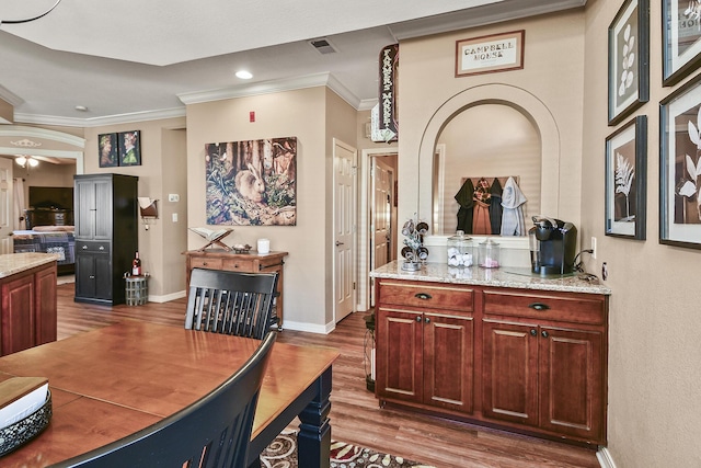 300 Glory Rd, Branson, MO 65616 - dining room with crown molding, dark wood finished floors, baseboards, recessed lighting, and arched walkways