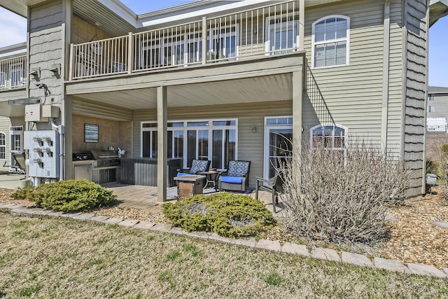 300 Glory Rd, Branson, MO 65616 - rear view of property with a balcony and a patio area