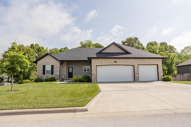 4738 N Florence Ave, Ozark, MO 65721 - view of front of property with driveway, an attached garage, brick siding, and board and batten siding