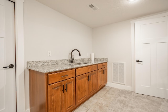 4738 N Florence Ave, Ozark, MO 65721 - laundry area with a sink, light tile patterned floors, and baseboards