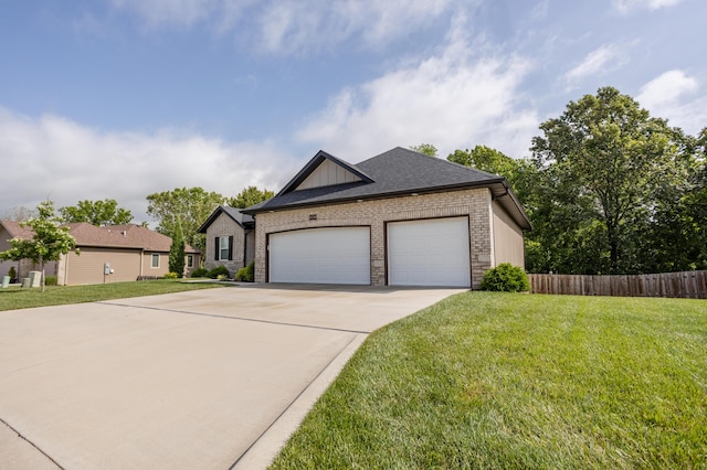 4738 N Florence Ave, Ozark, MO 65721 - view of front of property featuring concrete driveway, an attached garage, and brick siding