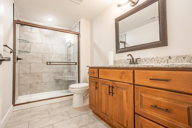 4738 N Florence Ave, Ozark, MO 65721 - bathroom with toilet, a stall shower, vanity, tile patterned flooring, and baseboards
