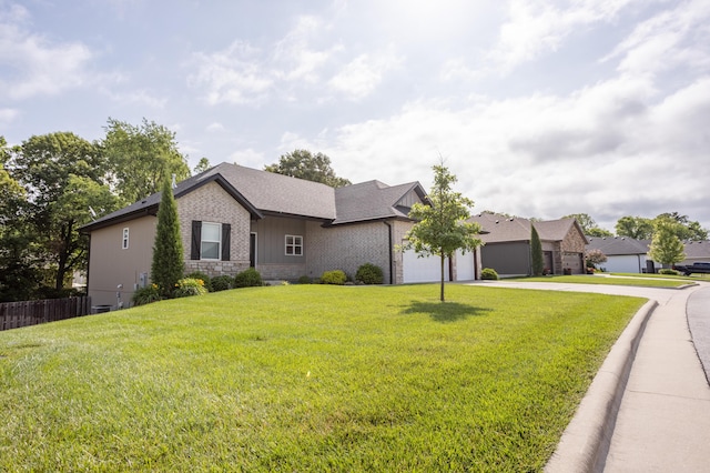 4738 N Florence Ave, Ozark, MO 65721 - single story home with concrete driveway, an attached garage, and brick siding