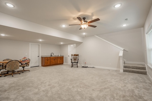 4738 N Florence Ave, Ozark, MO 65721 - living area featuring light carpet, stairway, recessed lighting, a ceiling fan, and wet bar