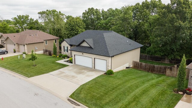 4738 N Florence Ave, Ozark, MO 65721 - view of front of home featuring concrete driveway and roof with shingles