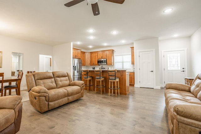 4738 N Florence Ave, Ozark, MO 65721 - living room featuring light wood-style floors, ceiling fan, recessed lighting, and baseboards
