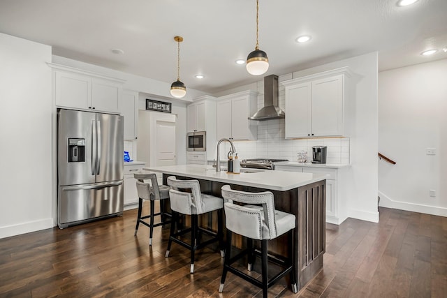 4786 E Whitman Rd, Springfield, MO 65802 - kitchen with stainless steel appliances, wall chimney exhaust hood, light countertops, baseboards, and recessed lighting