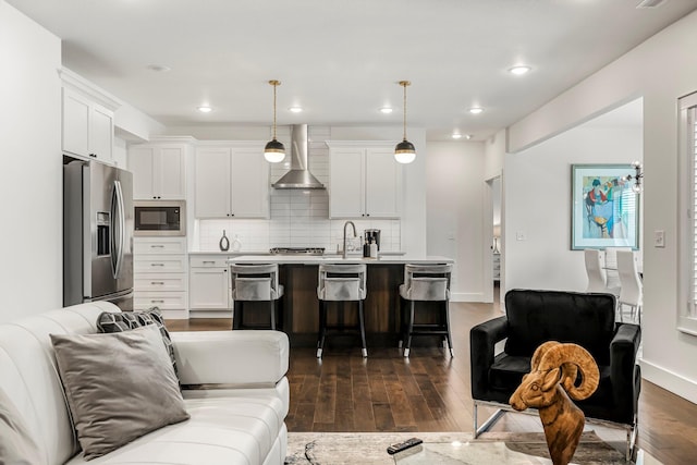 4786 E Whitman Rd, Springfield, MO 65802 - living room featuring dark wood-style flooring, recessed lighting, and baseboards