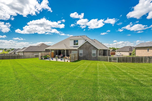 4786 E Whitman Rd, Springfield, MO 65802 - back of property with a patio area, brick siding, and outdoor lounge area