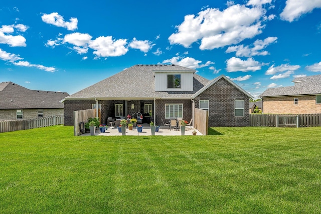 4786 E Whitman Rd, Springfield, MO 65802 - back of property with a patio, brick siding, and roof with shingles