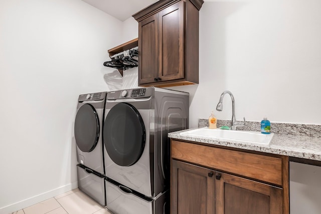 4786 E Whitman Rd, Springfield, MO 65802 - laundry room with washer and clothes dryer, cabinet space, baseboards, and light tile patterned flooring