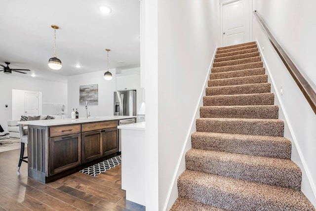 4786 E Whitman Rd, Springfield, MO 65802 - stairs with wood finished floors, recessed lighting, and ceiling fan
