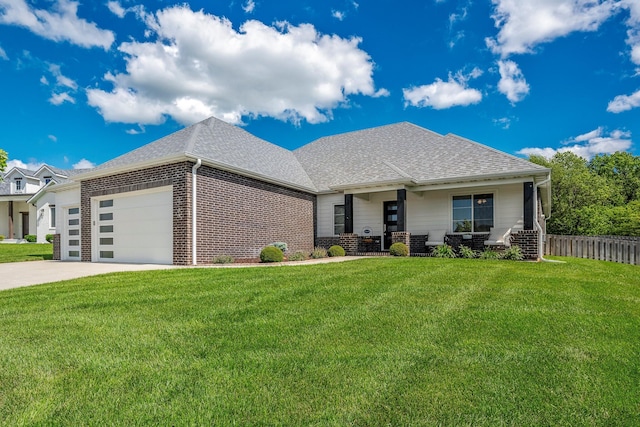 4786 E Whitman Rd, Springfield, MO 65802 - view of front of home with brick siding, a garage, roof with shingles, and driveway