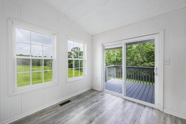 2800 State Highway Bb, Hollister, MO 65672 - empty room featuring vaulted ceiling, wood finished floors, baseboards, and wood walls