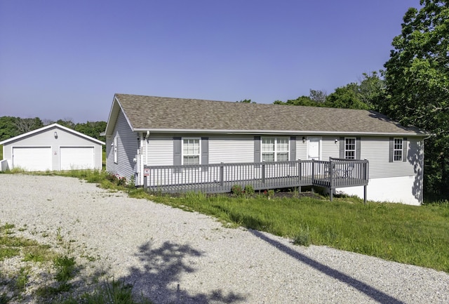 2800 State Highway Bb, Hollister, MO 65672 - view of front of property featuring a detached garage, an outdoor structure, a deck, and roof with shingles